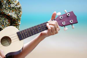 Playing the Ukulele on the beach