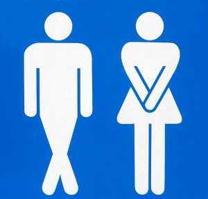 man and woman need to pee