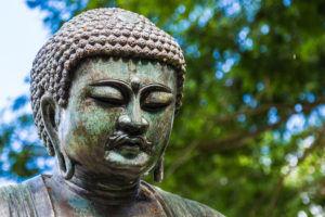 A replica of Daibutsu, The Great Buddha of Kamakura, at Foster Botanical Gardens on Oahu, Hawaii
